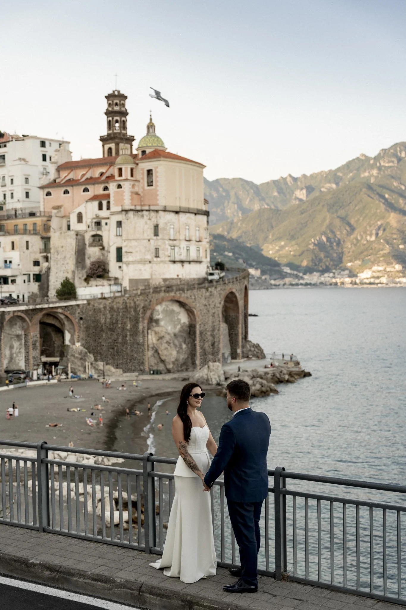 Intimate luxury wedding moments in the picturesque square of Atrani, Amalfi Coast. Cinematic editorial wedding photography in Italy.