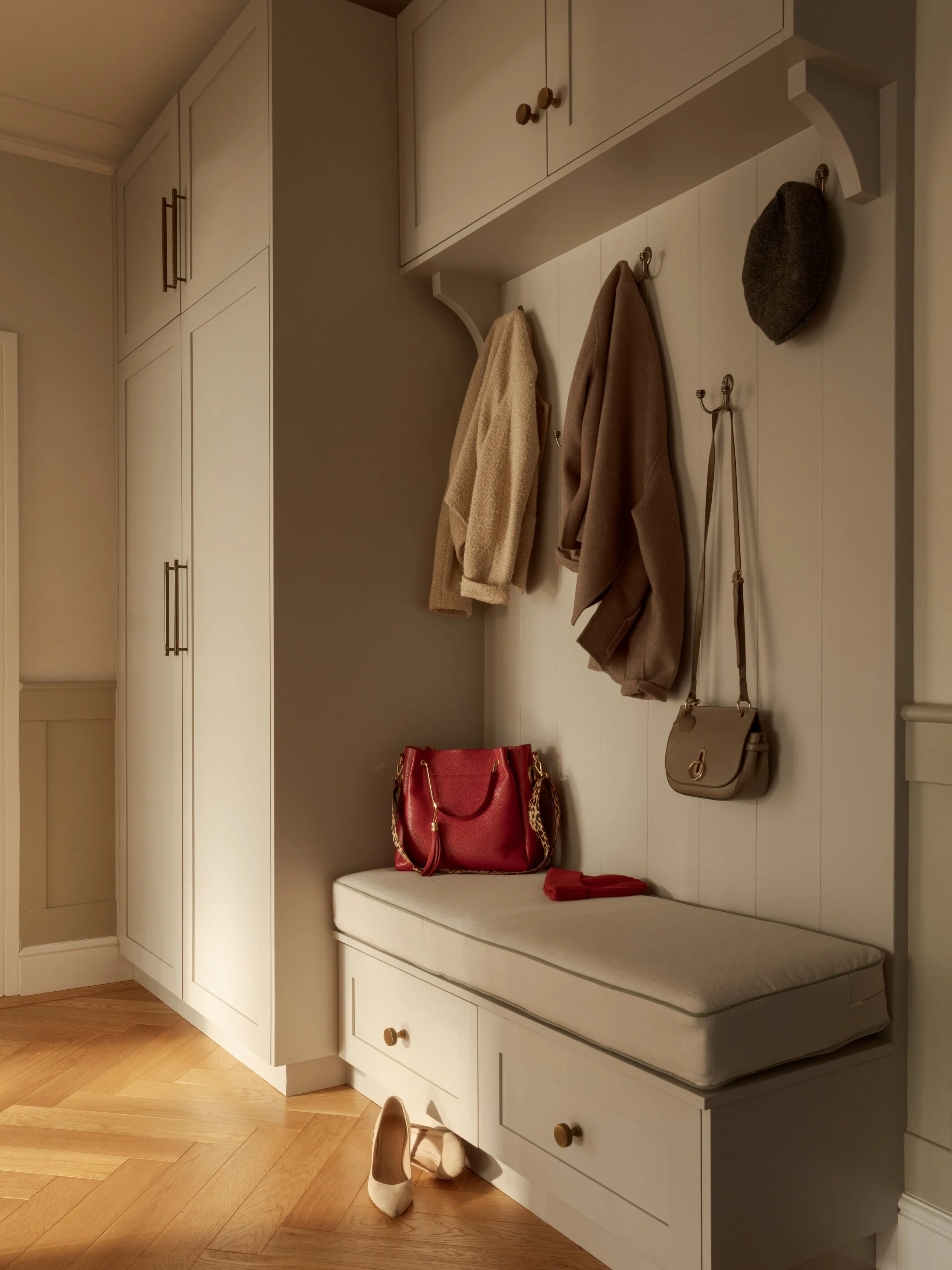 Boot room floor to ceiling bespoke joinery with seating space. Plenty of storage for coats, shoes, hats and handbags.