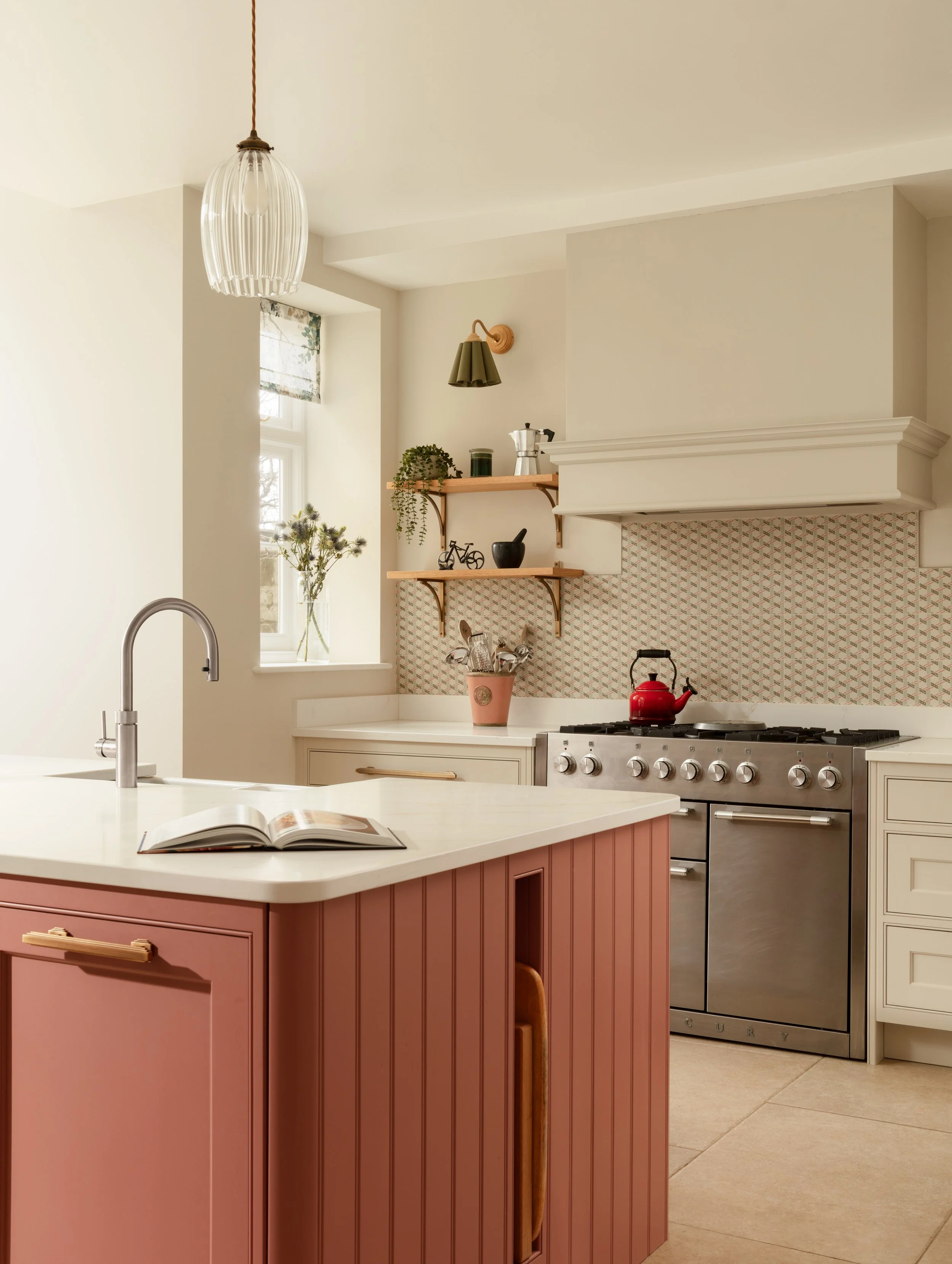 Luxury Shaker Kitchen, large quartz worktop, tiled splashback, sconce lights, pendants by Jim Lawrence, Quooker tap, hand painted in Little Greene off white with a pink island. Period property in Barnes.