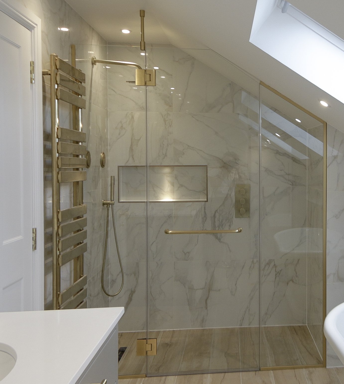 Luxury walkin shower. Brass fixtures, made to measure glass enclosure, massage jets.
