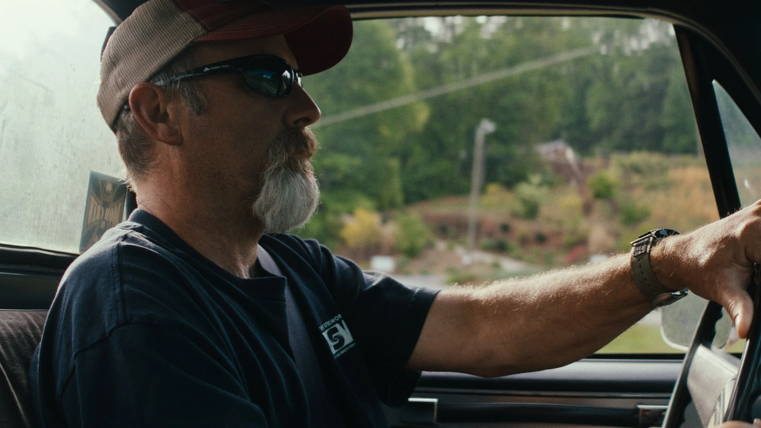 Mill worker Puppy Scott driving.jpg