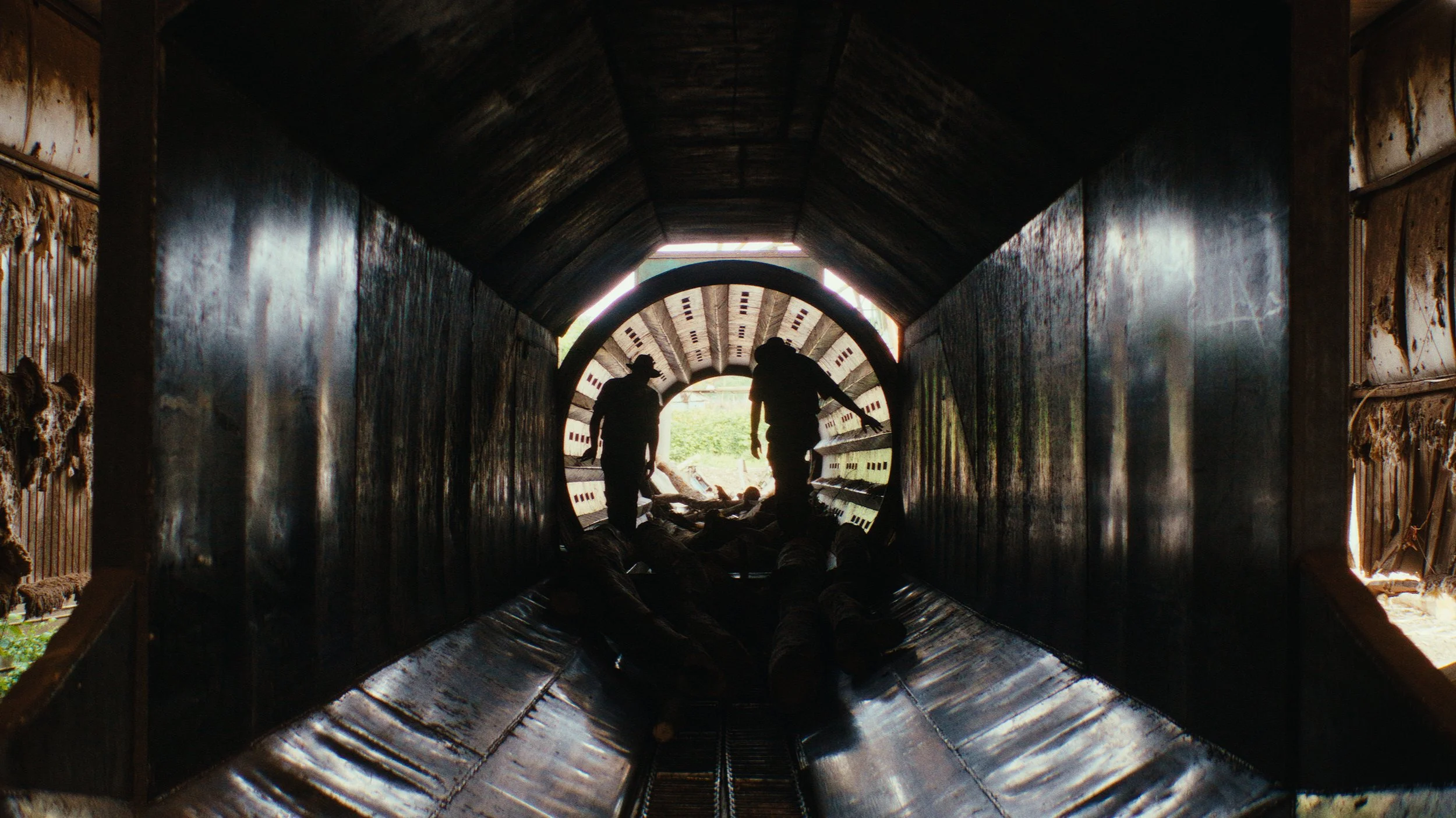 Capps Brothers walk through machinery on their property.jpg