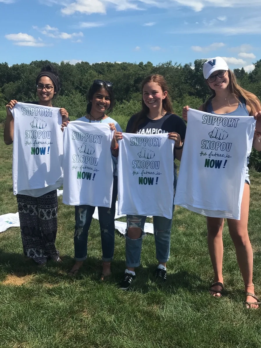  Teen campaign volunteers printing helping to print t-shirts 