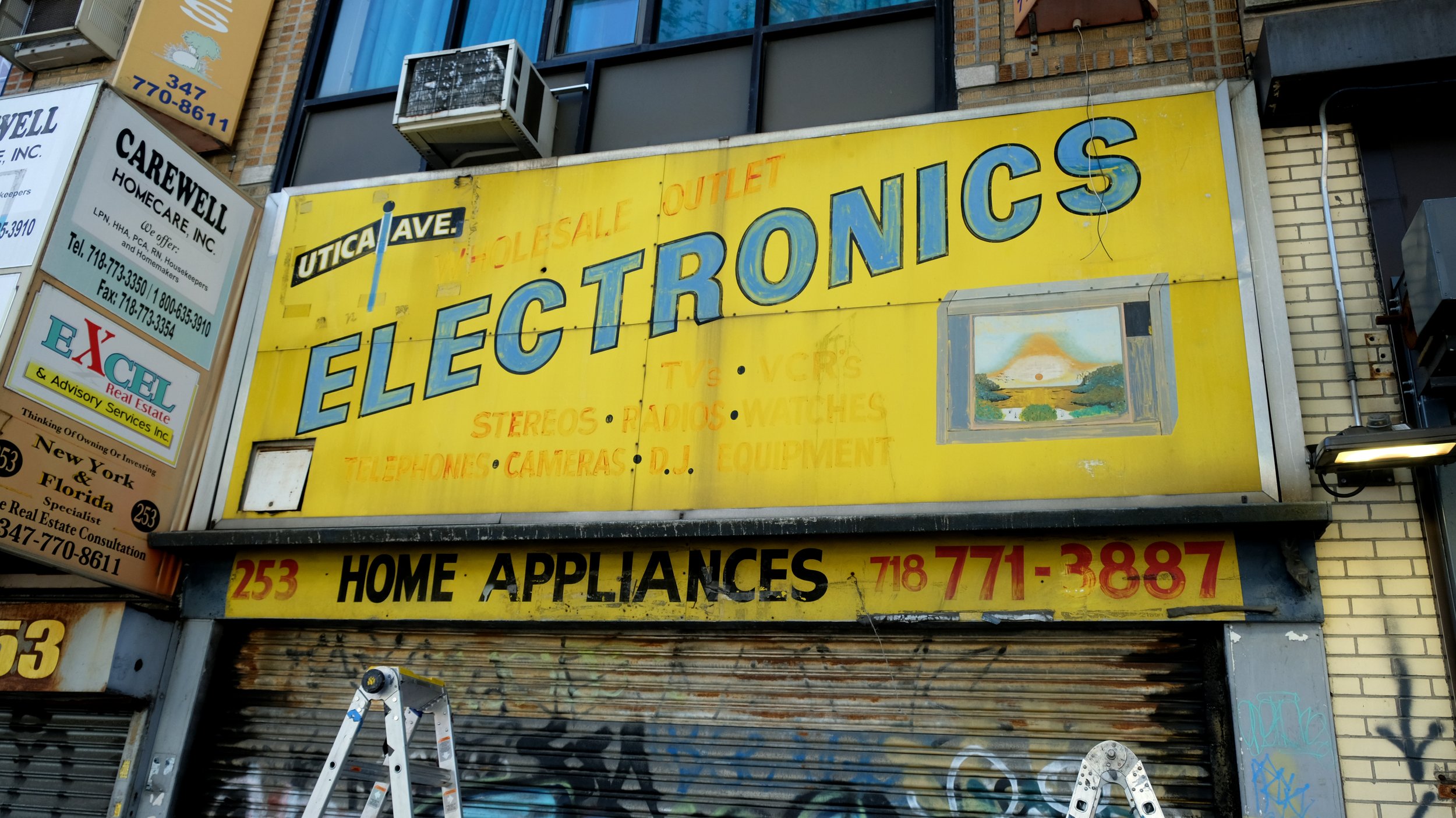 Utica Ave Electronics Storefront Signage