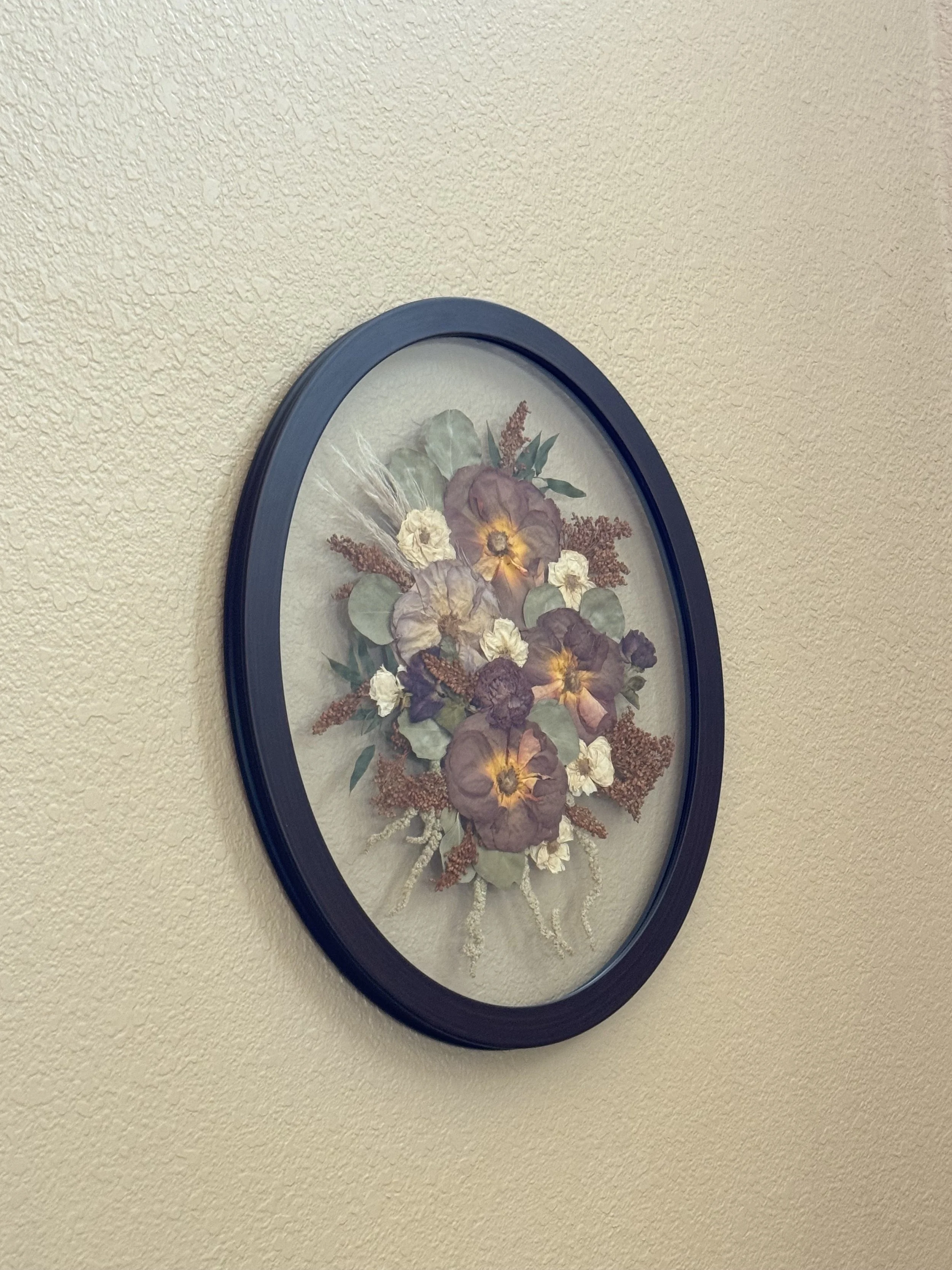 Black Oval Bouquet Frame with Preserved Wedding Flowers.jpeg