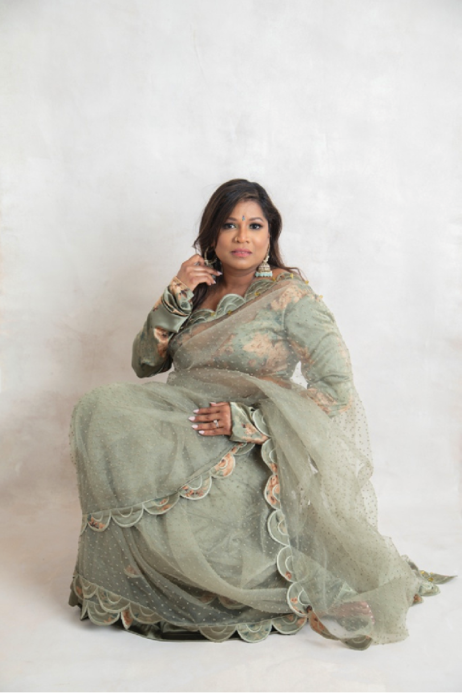 Meera Singh Chhedi

Meera’s image comes from a memory of our grandmothers and the Orhni. That quiet, familiar moment when they would lift the fabric and place it over their heads. There was always something gentle in that action, something unspoken b