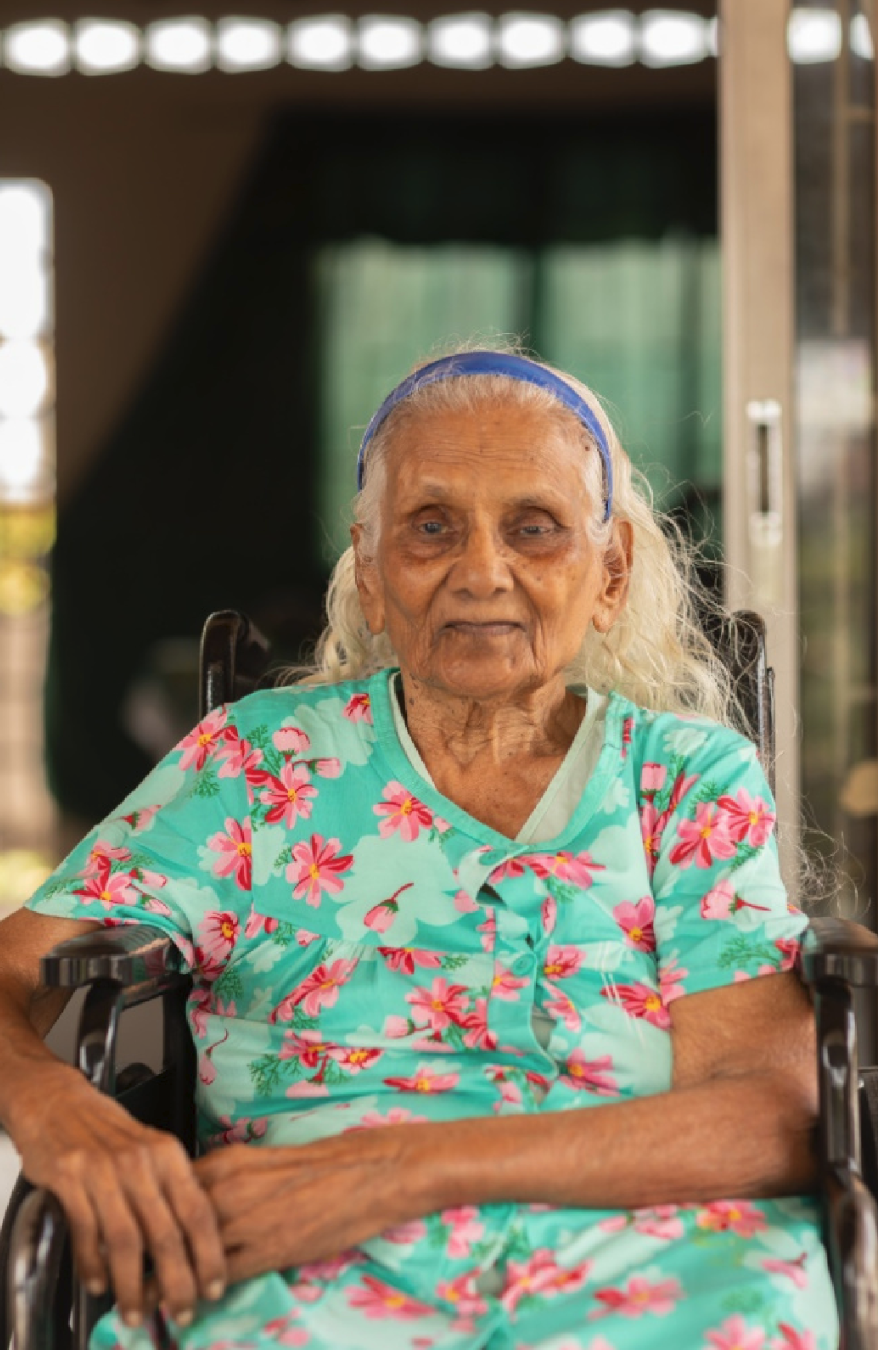 Ameeran Mohammed

Ameeran Mohammed’s life reflects a quiet strength shaped by tradition, limitation, and deep community care. Growing up in Orange Field as one of nine siblings, she was part of a large, layered family where stories of adoption and ki