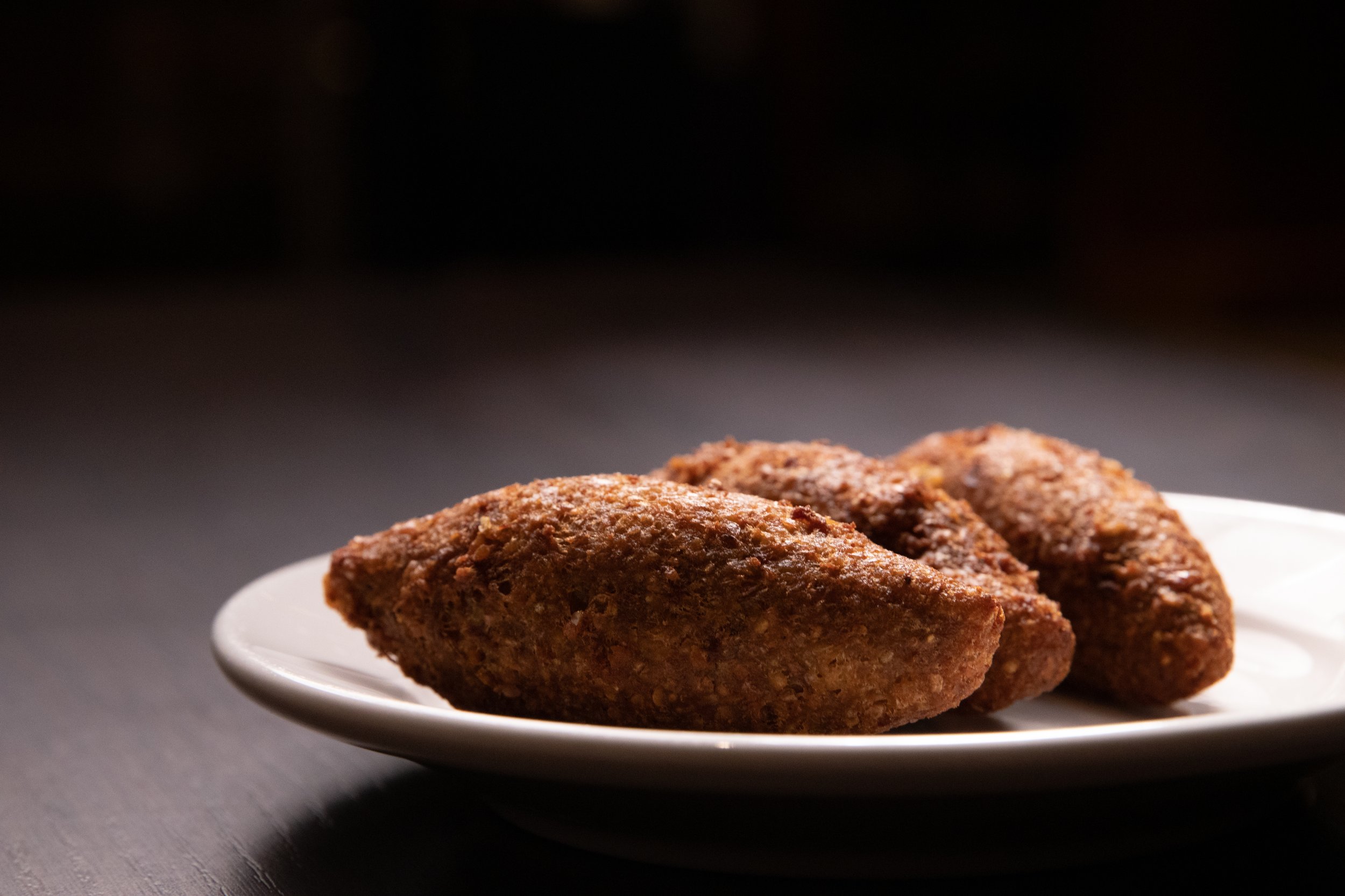 kebbeh - whole wheat shell stuffed with ground beef & onion