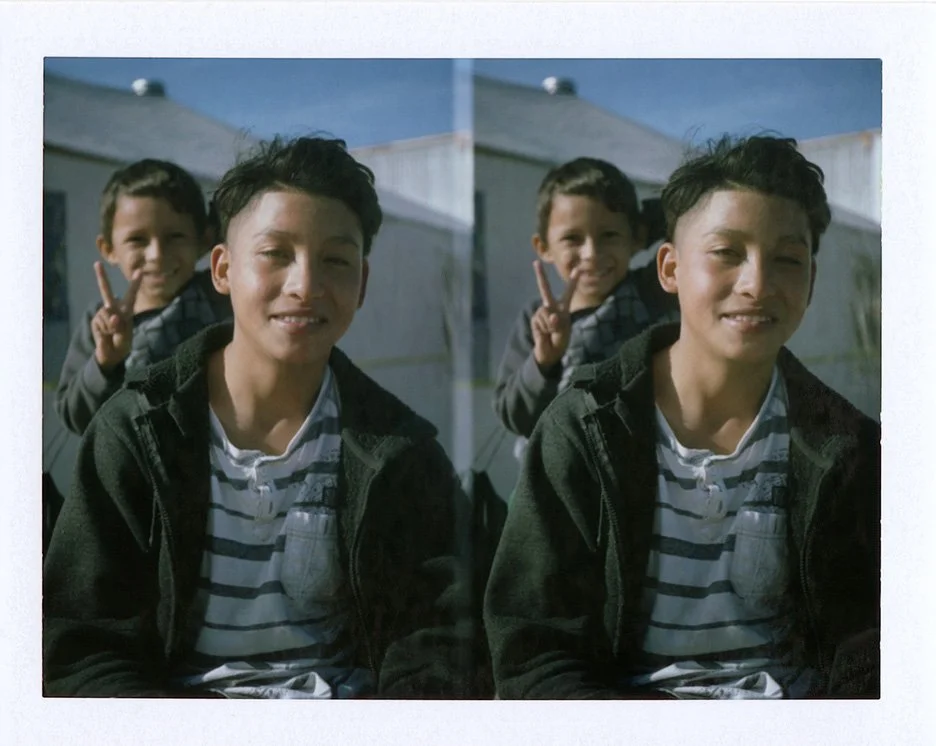 Polaroid portraits from the migrant caravan by photojournalist Alex Cave.