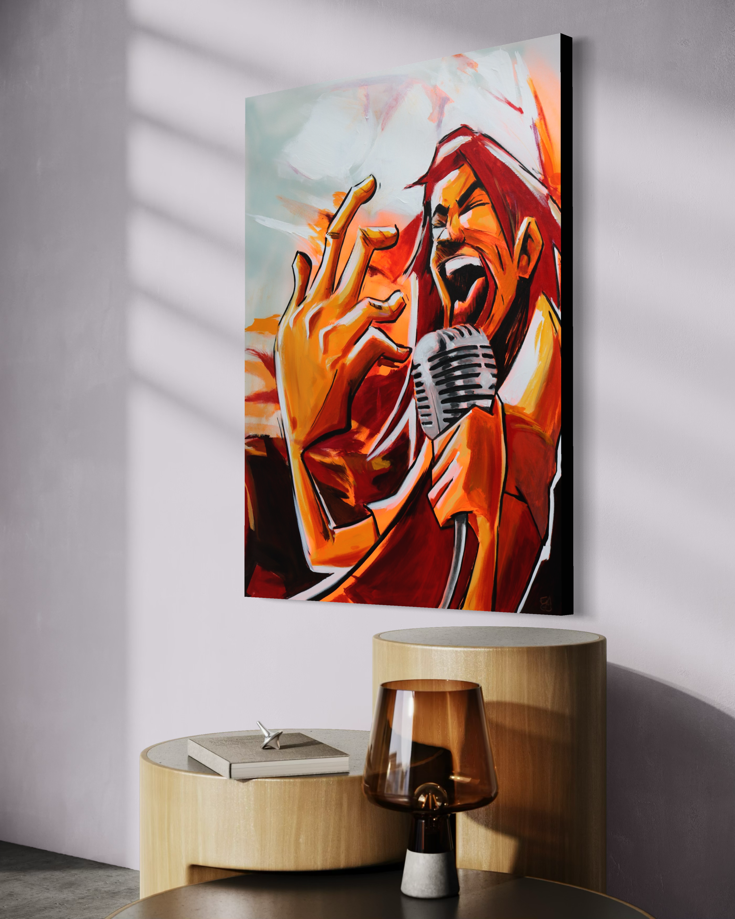 A colorful painting of a singer with red hair, singing into a retro microphone, with a hand raised near the face, displayed on a gallery wall with wood furniture and a glass lamp in front.