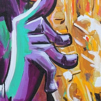 Close-up of a colorful, abstract painting of a hand with purple and turquoise tones, with a wooden surface background and some scattered paint splatters.
