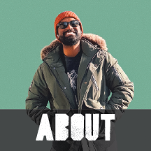 A man wearing sunglasses, a knit beanie, and a winter jacket with a fur-lined hood, smiling against a light green background with the word 'ABOUT' at the bottom.