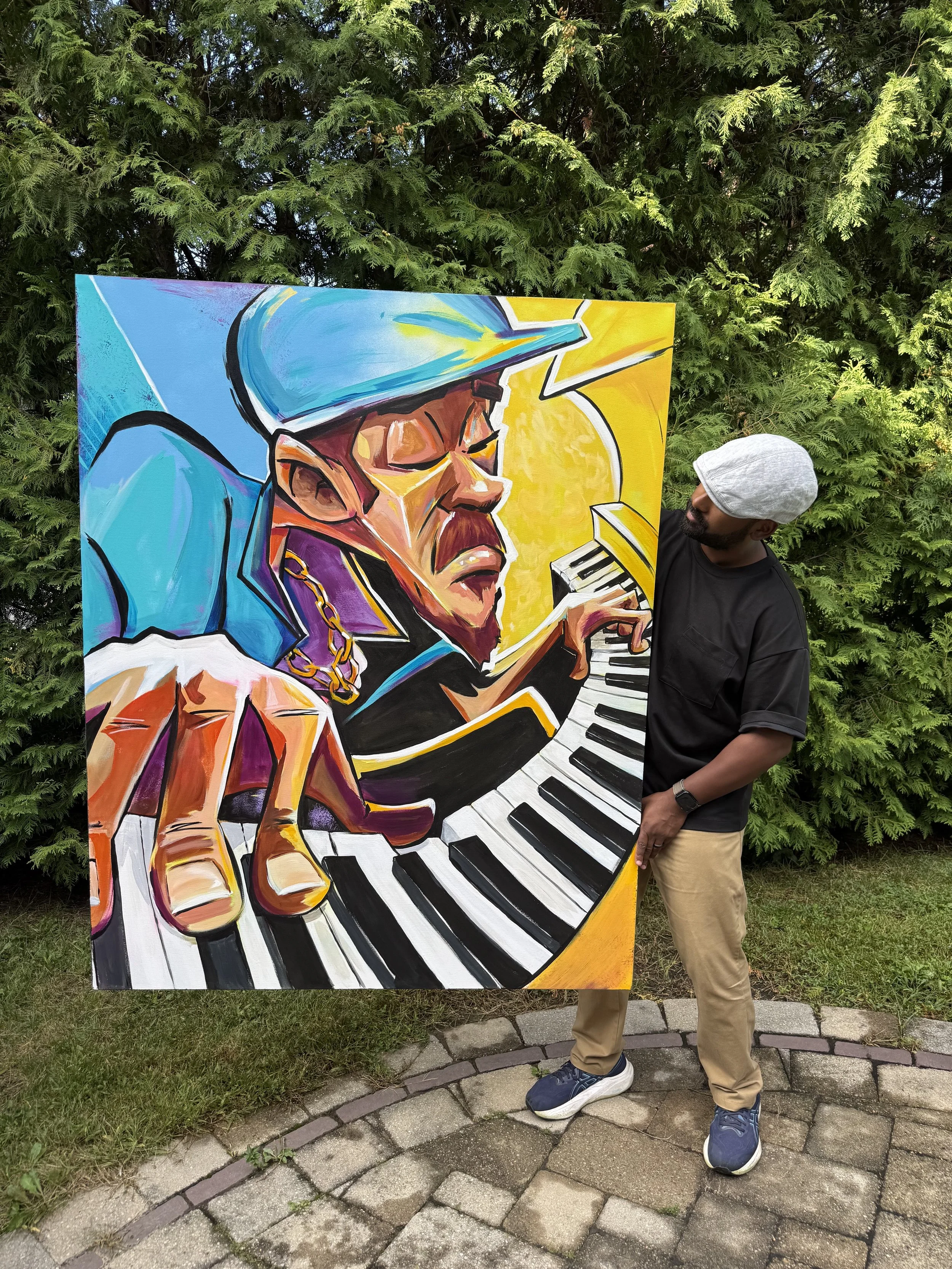 A man wearing a gray cap, black shirt, beige pants, and blue sneakers stands next to a colorful painting of a saxophone player. The painting depicts a stylized portrait of a man wearing sunglasses and a blue hat, playing the keyboard. The scene is ou