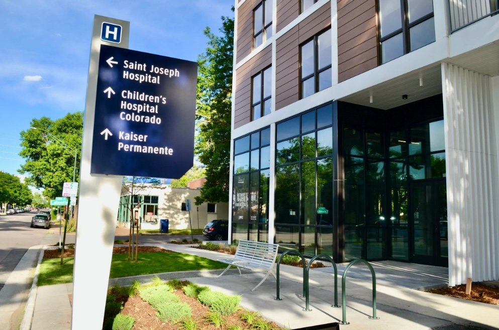 park-17-apartments-multifamily-retail-east-17th-denver-exterior-hospital-sign.jpg