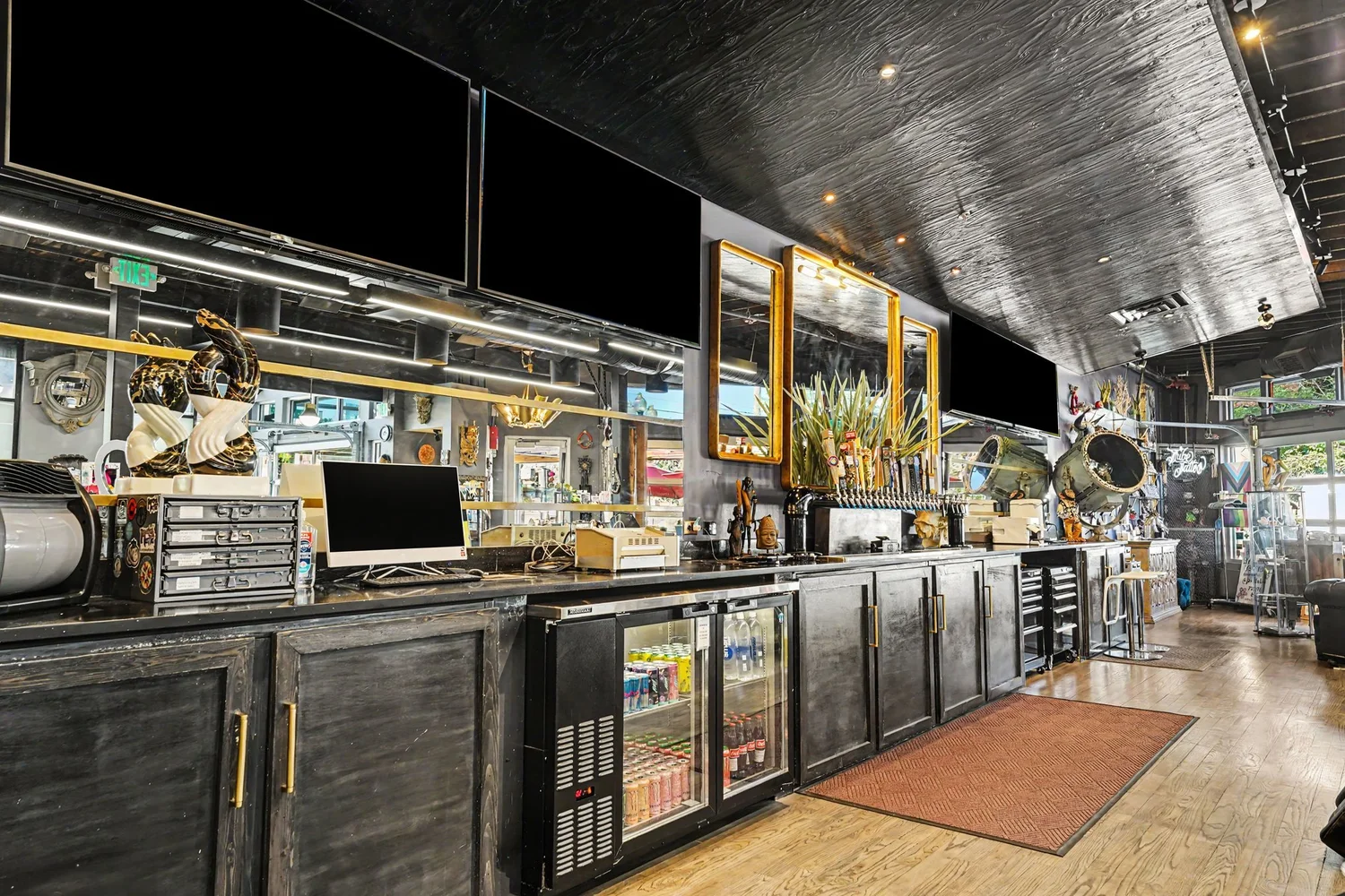 Restaurant bar with beverage taps and televisions