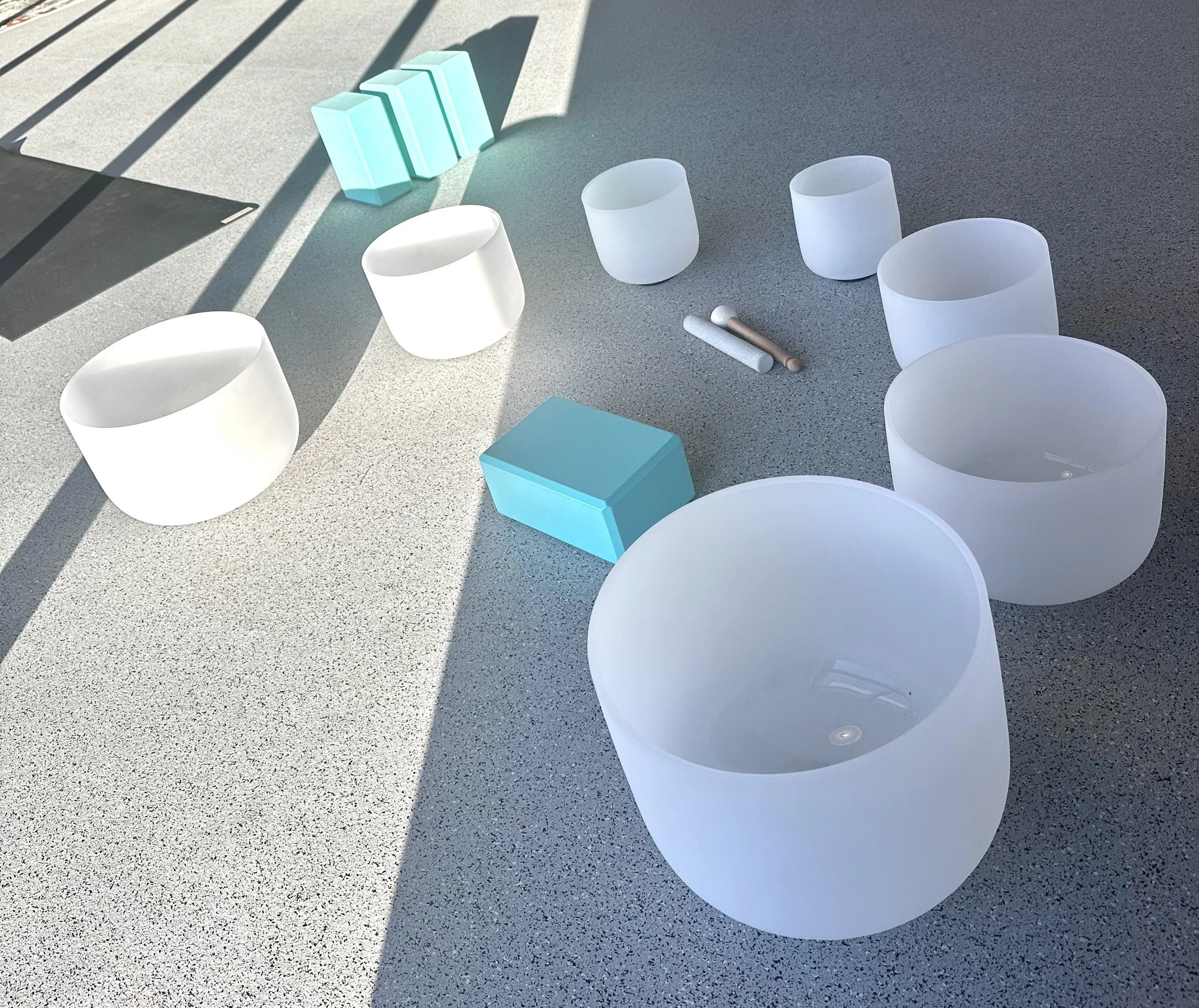 Two women taking a selfie on a rooftop or outdoor terrace, smiling and posing for the camera.