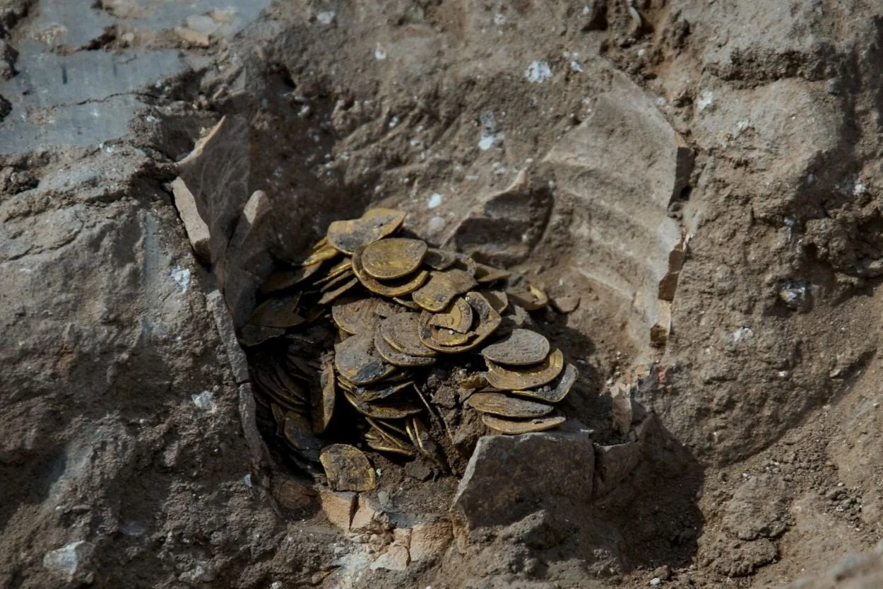 jar full of ancients coins in ground