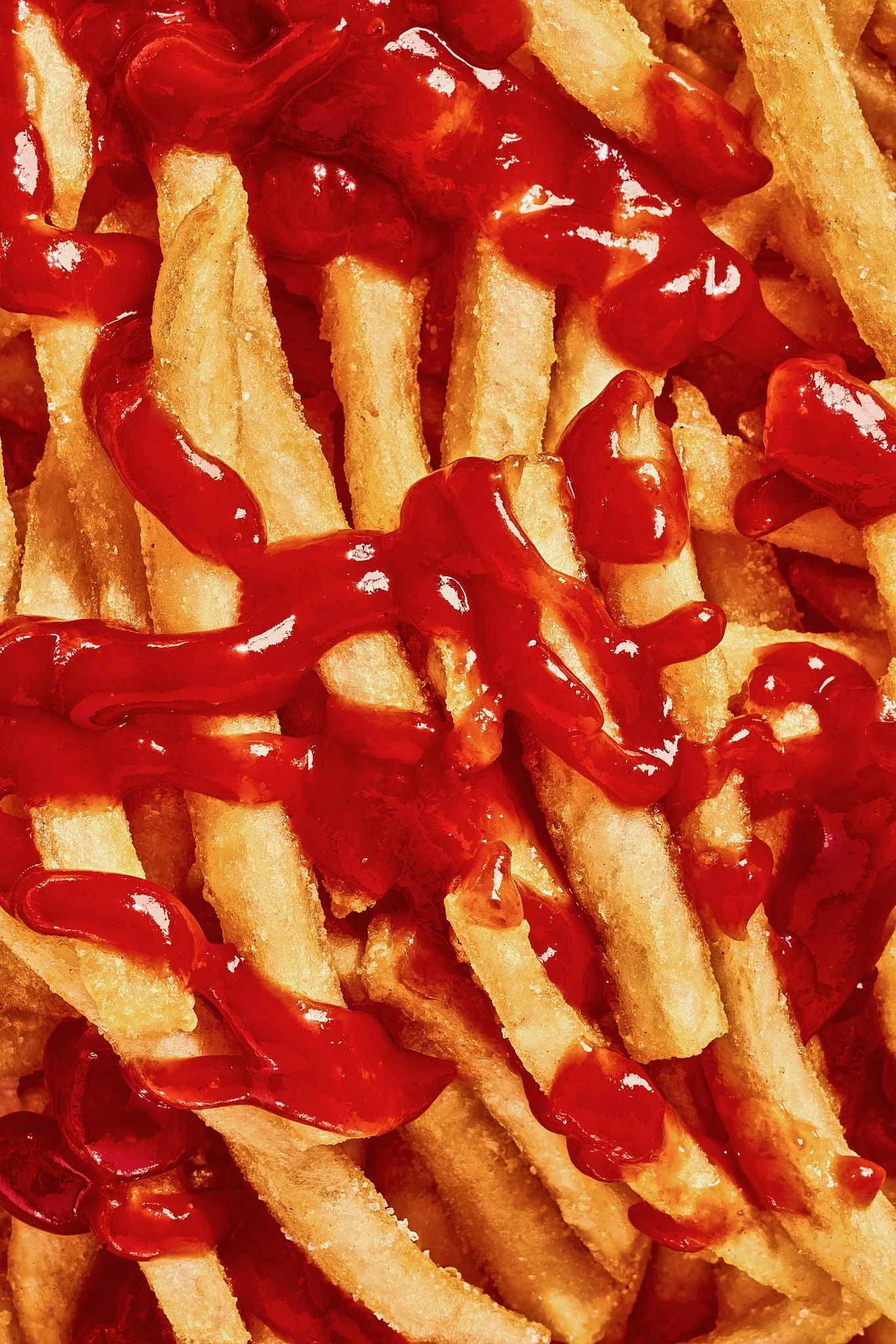Close-up of French fries with ketchup, styled for a commercial shoot by a food stylist in Colorado.
