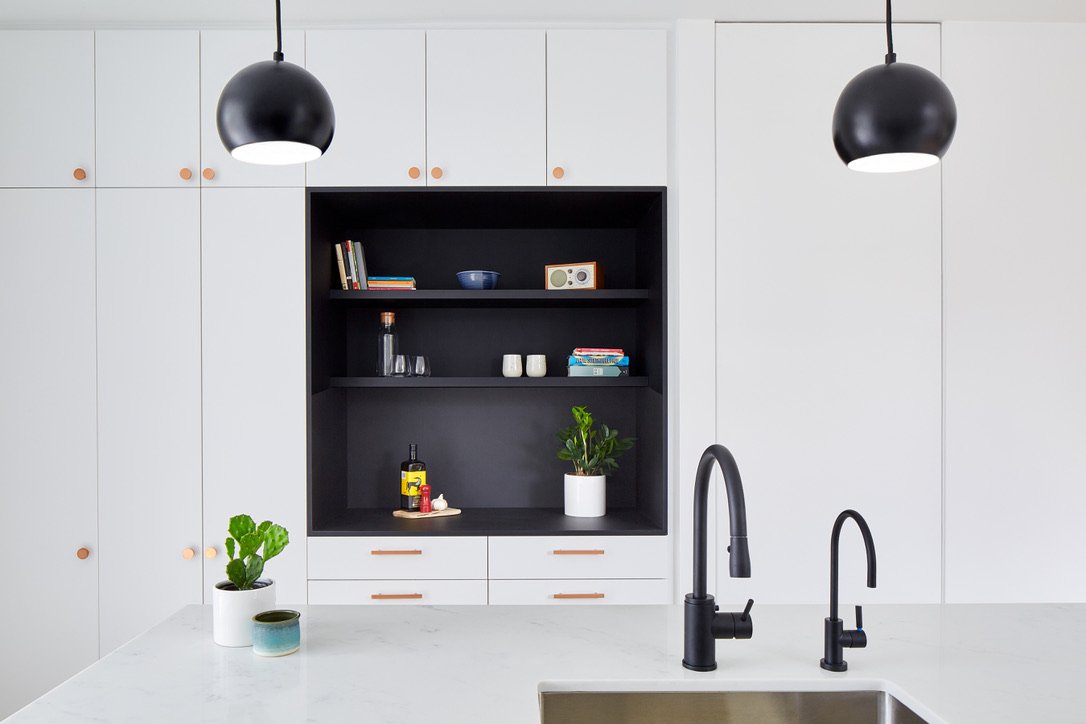 custom Fenix cabinetry with a custom eight foot bi-swing door