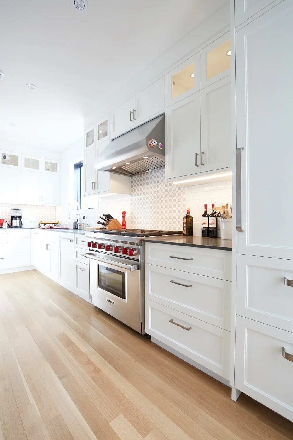 Custom shaker cabinets with a Wolf range and hood fan