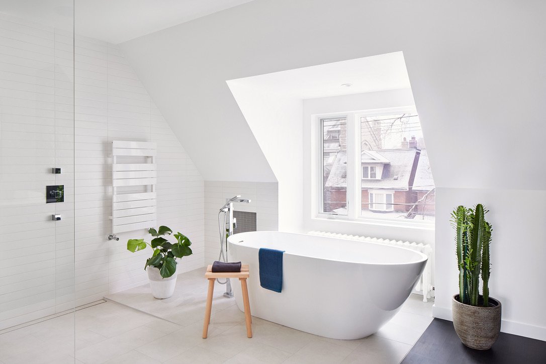 stand alone tub with curbless shower and heated towel bar
