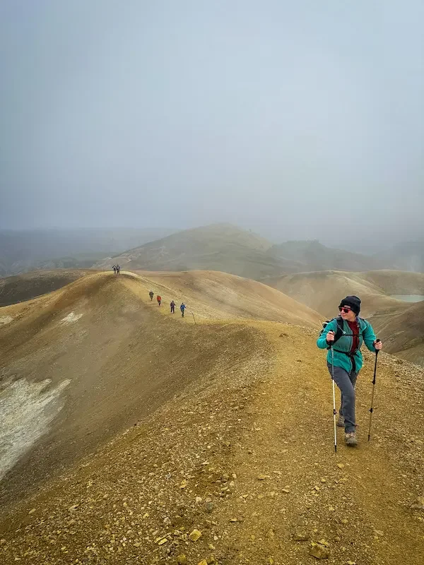 hikers on ridge trail on laugavegur trek in iceland