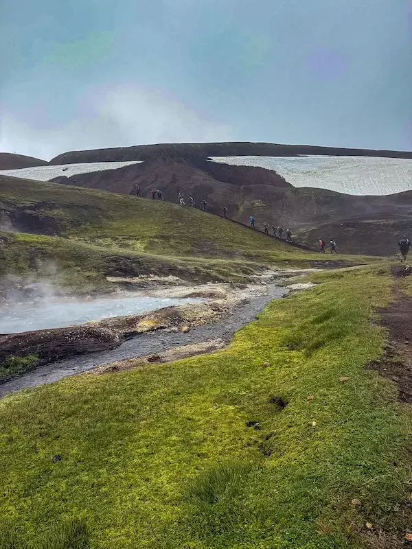small river with snowy back hills in background