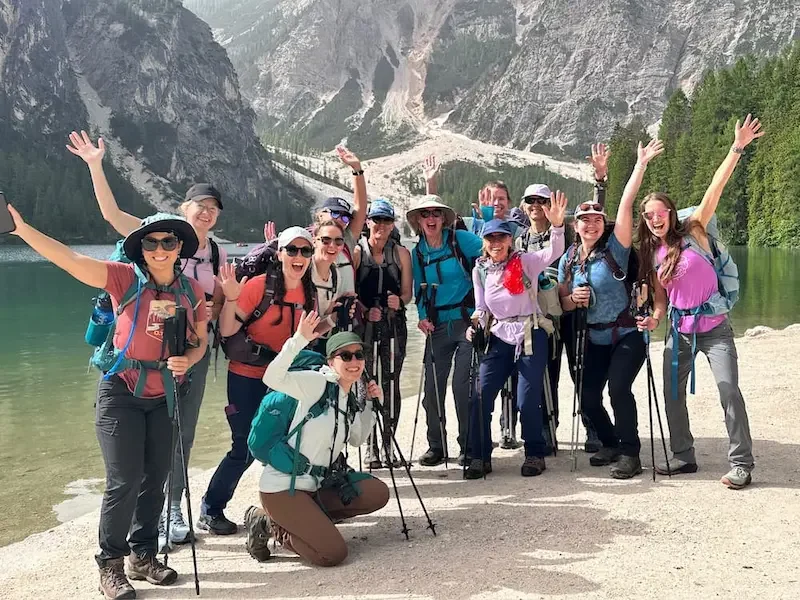 group of women in front of lake at start of dolomites trek