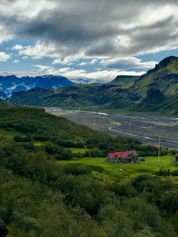 laugavegur trek hut in iceland valley with mountains and clouds
