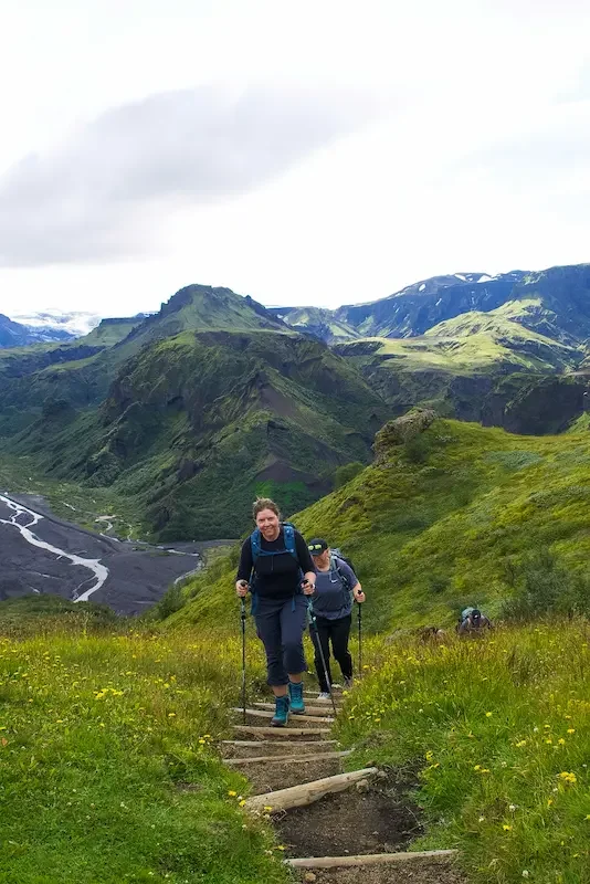 hikers walking up step trail on laugavegur trek in iceland