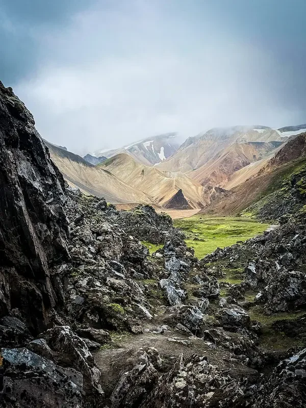 iceland valley on laugavegur trail wtih green grass and brown mountains