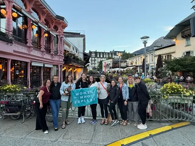 groups of women in front of pink restaurant in chamonix