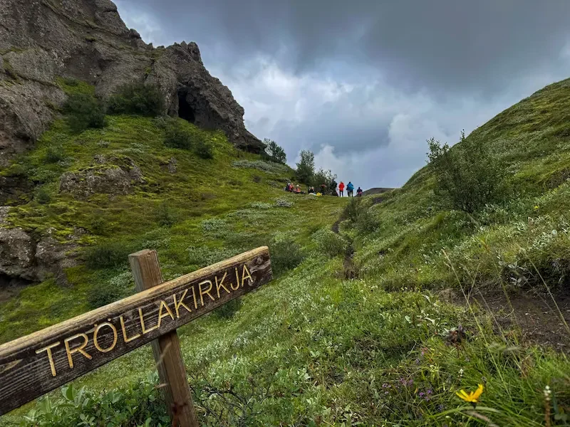 trail sign on laugavegur trek with hikers far away