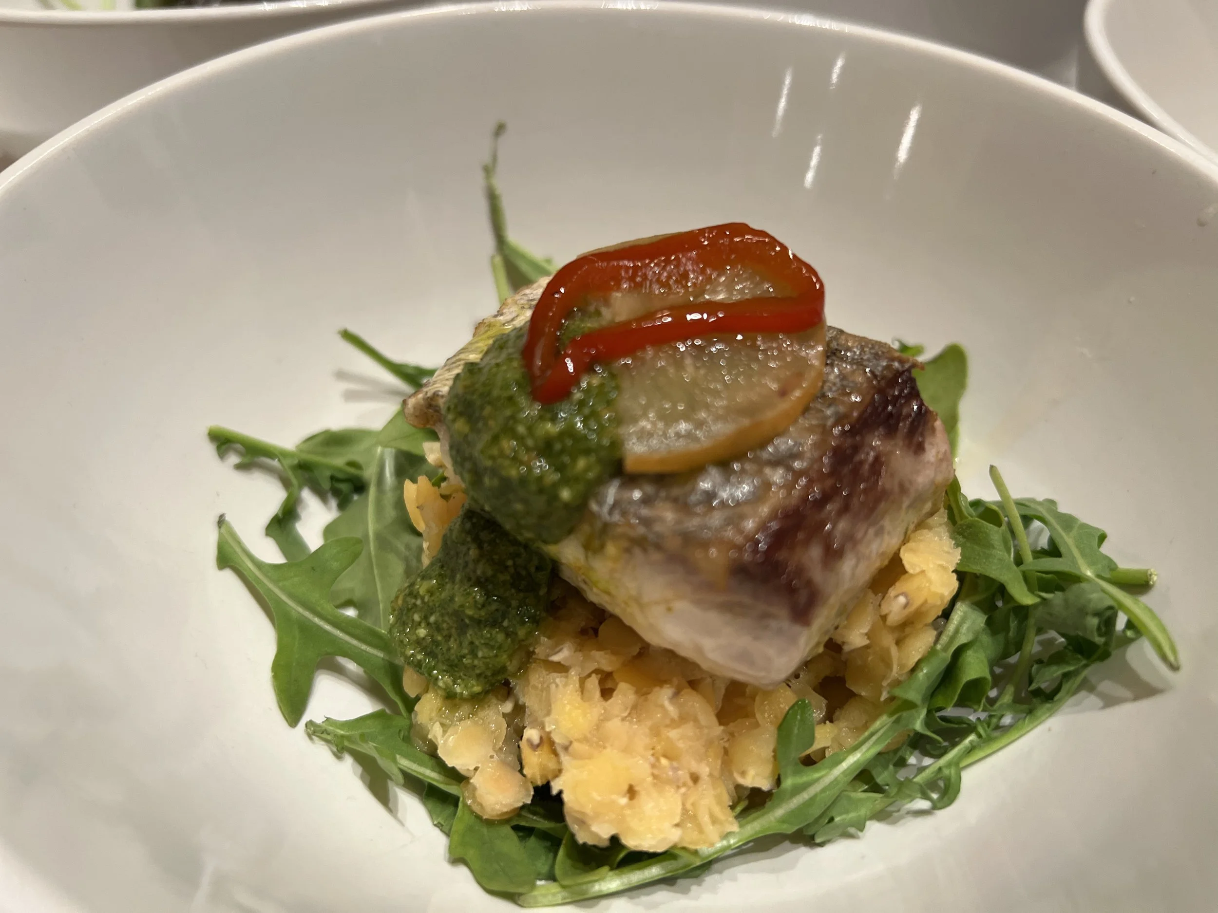 Sous Vide Black Bass, Crimson Lentils, Rocket, Pistachio Pesto, Preserved Lemon
