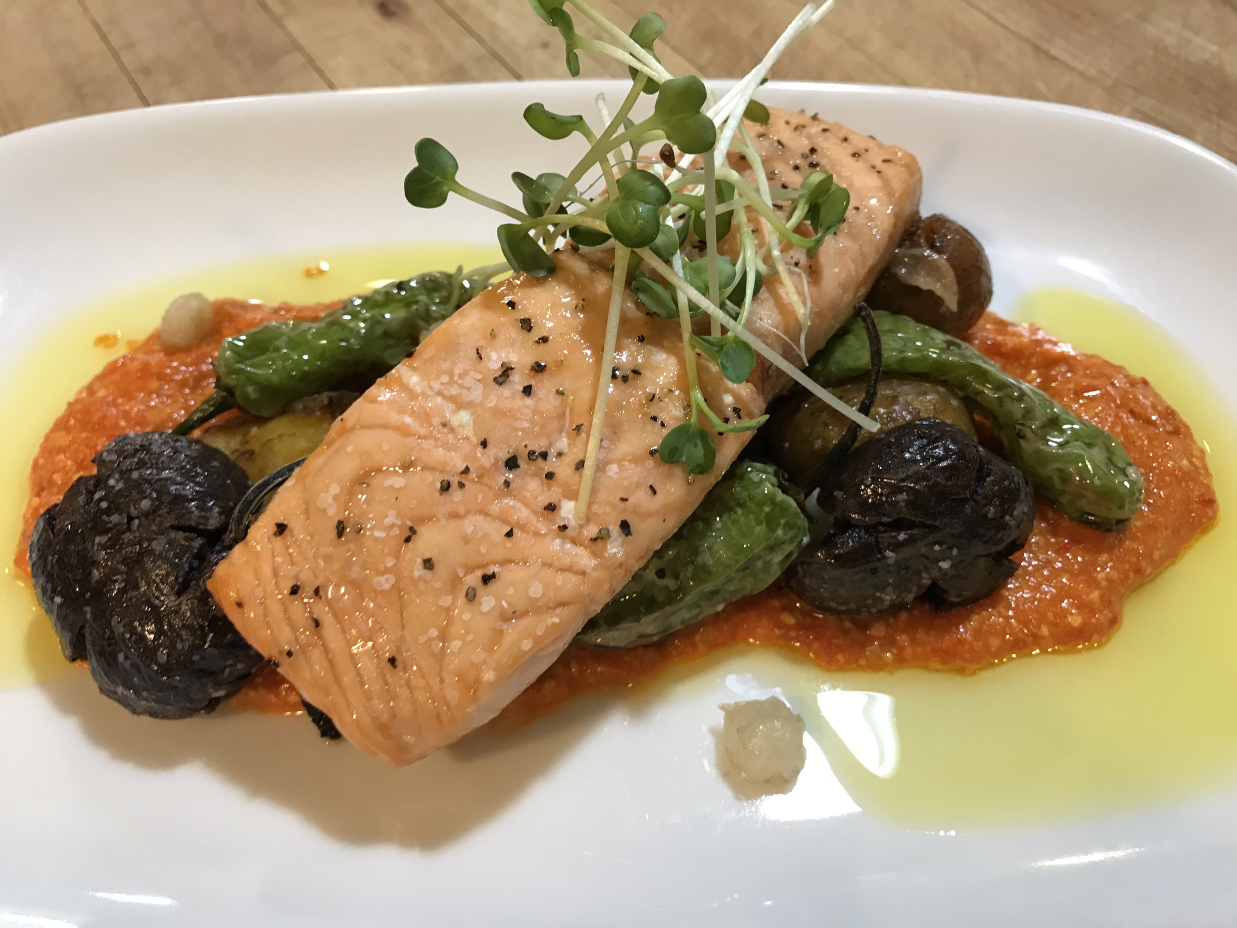 Olive Oil Poached Wild Salmon, Crispy Baby Potato-Shishito Medley, Cashew Romesco Sauce
