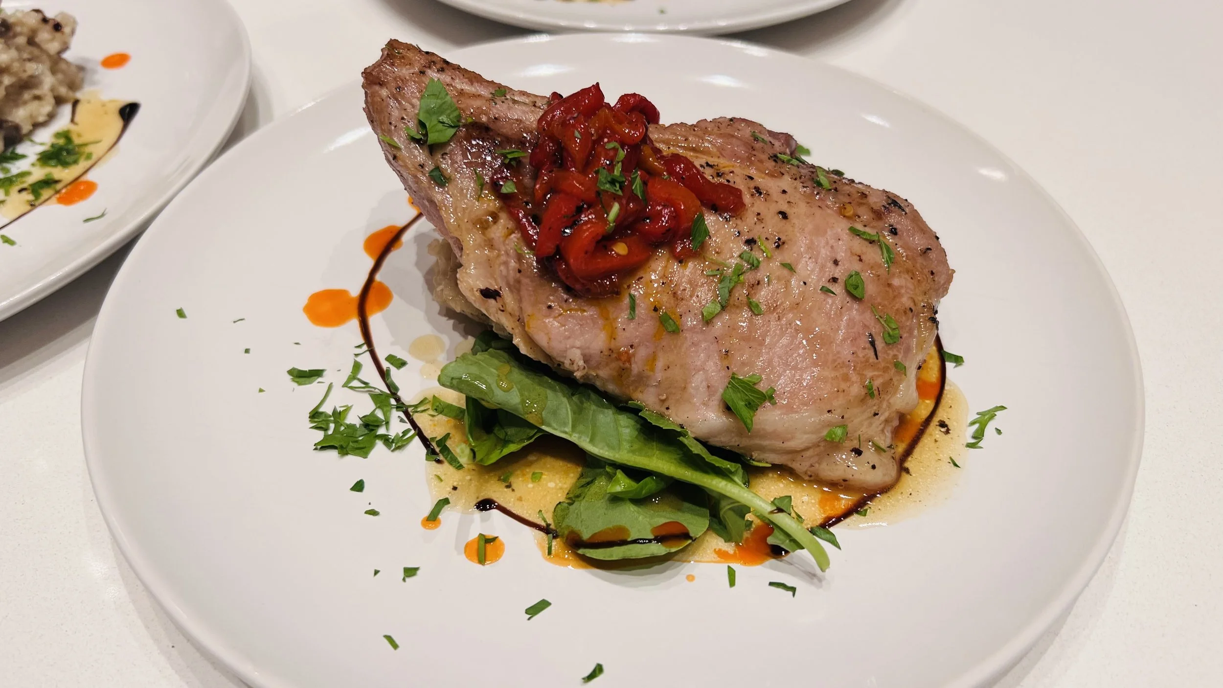 Kurobuta Bone-In Pork Chop, Fire Roasted Sweet Peppers, Farro ‘Risotto’, Warm Baby Spinach, Pan Jus