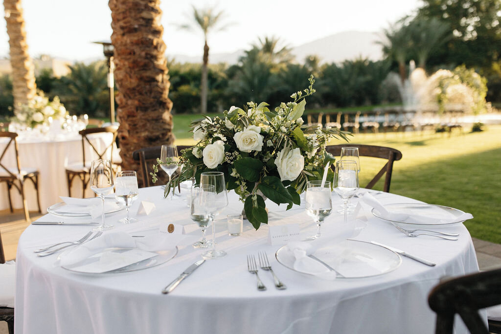 Surrounded by the beauty of Palm Springs and elegant all-white decor, this outdoor reception was a dream come true! The crisp and clean look of white flowers and modern serving ware can make any space feel more open and airy, giving your wedding a fr