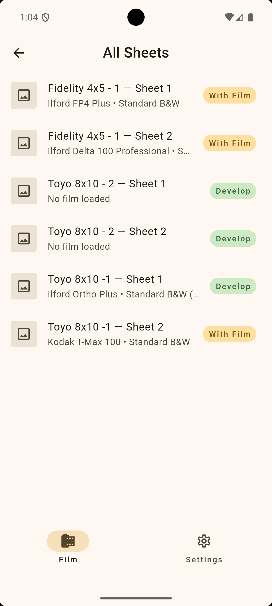 A mobile phone screen showing a list of film sheets with various labels and statuses, like 'With Film' and 'Develop', under the 'All Sheets' section, with navigation icons at the bottom for 'Film' and 'Settings.'
