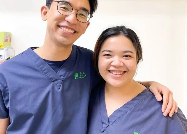 Dr Sean and the happy staff of Smile Plus Dental Clinic smiling together