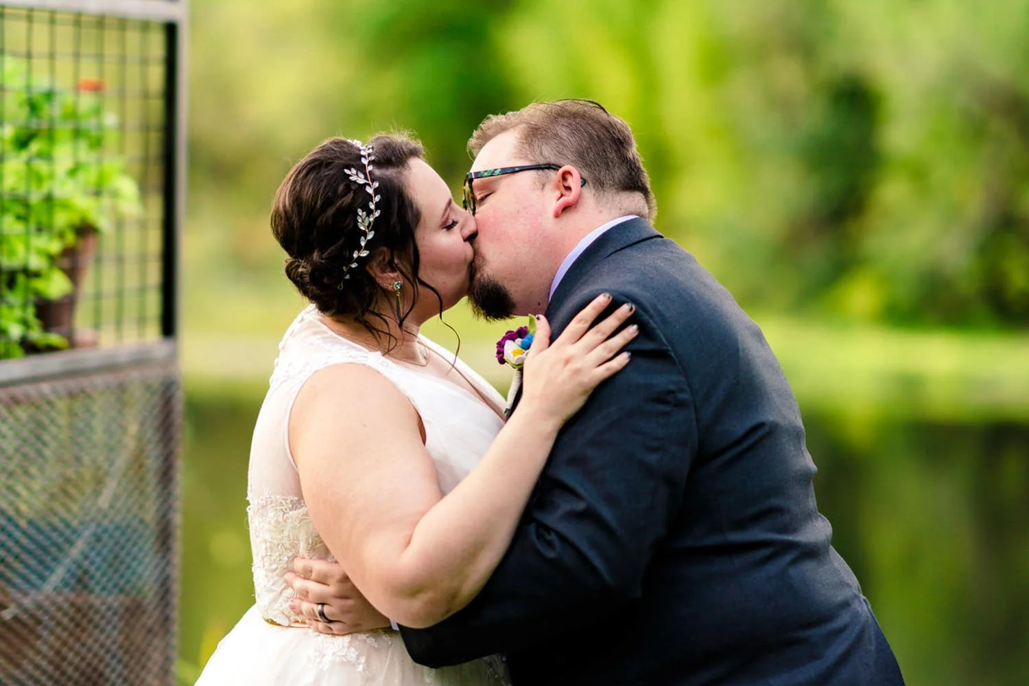 Couple sharing their first kiss during a simple backyard elopement in Clackamas, Oregon.