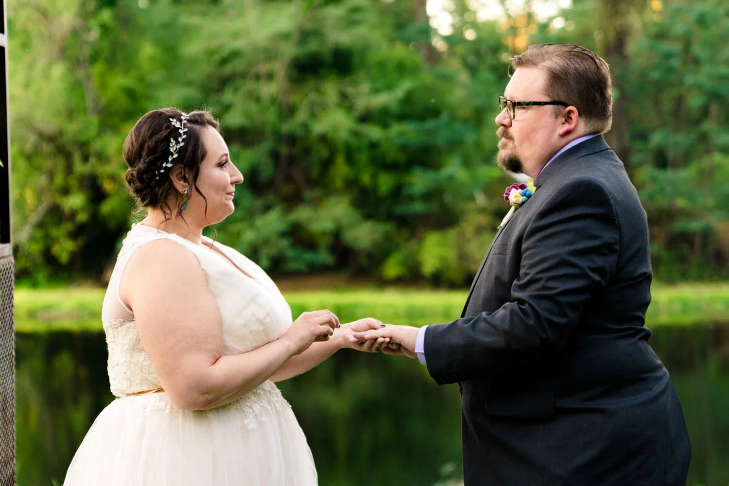 Couple exchanging rings during a simple elopement by the Clackamas River in Oregon.