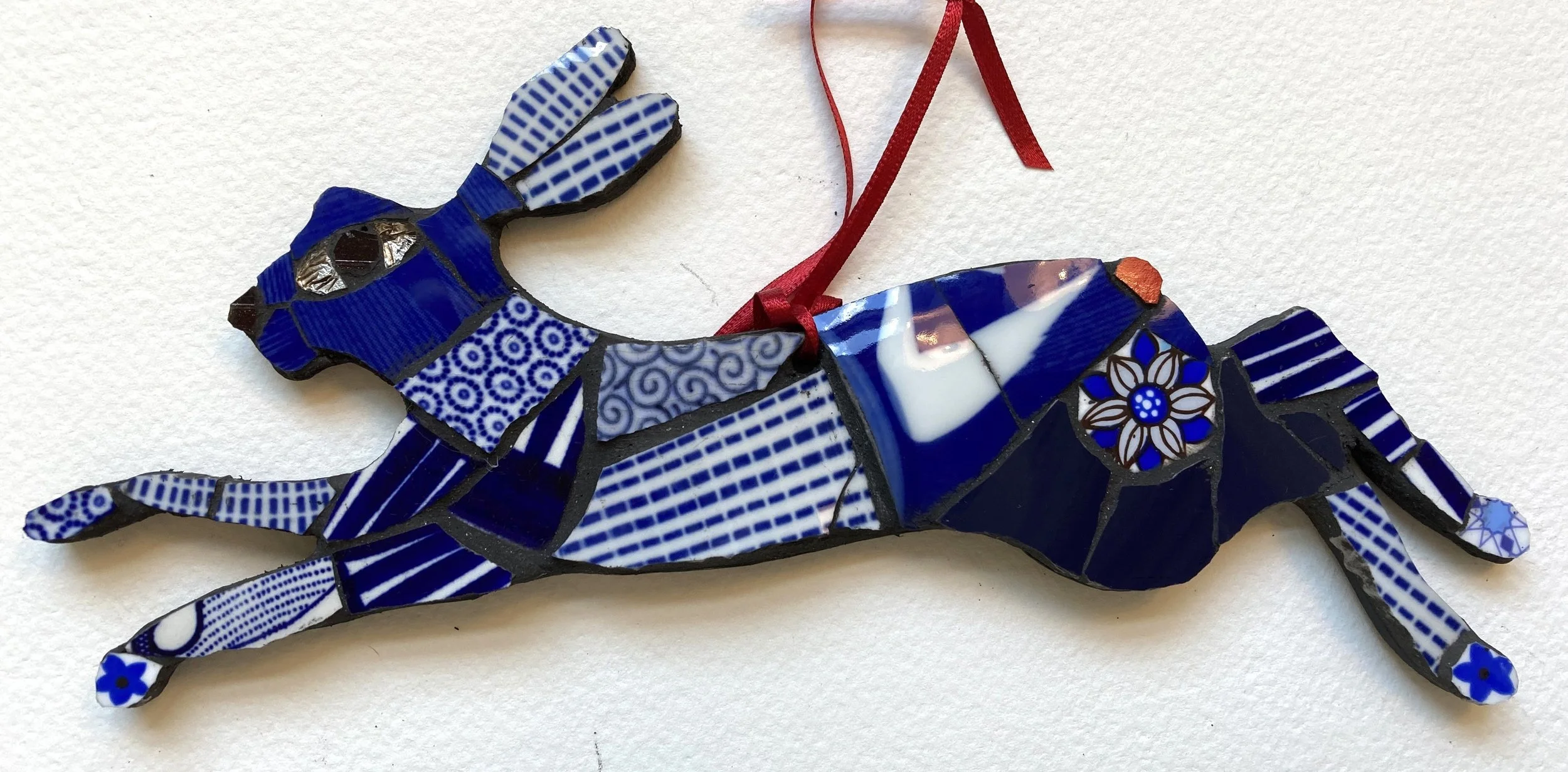 Running hare - blue & white, red tail.jpg