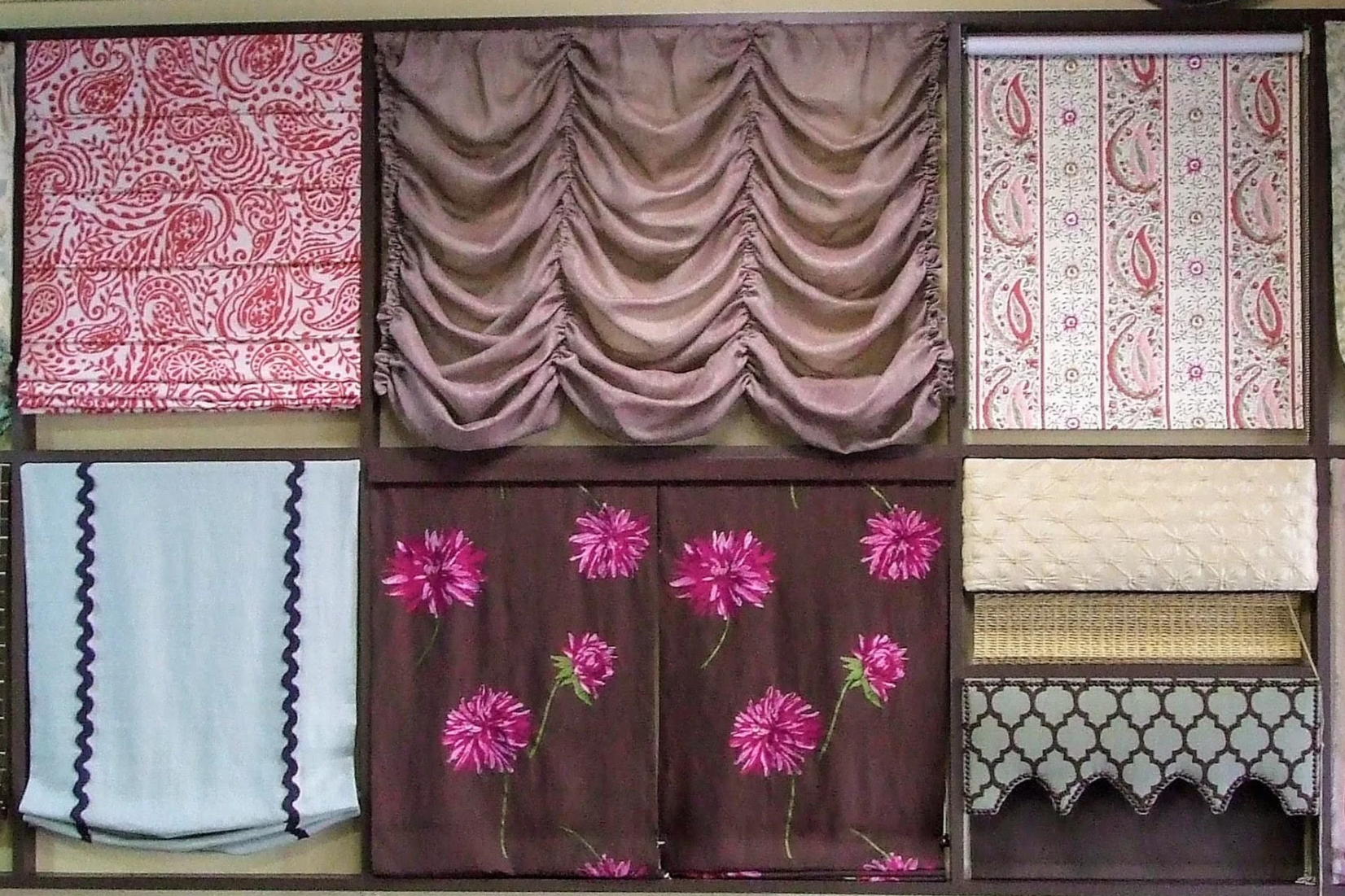 Custom window treatment displays at the former Spice Hill Interiors showroom in Ossining, New York, showcasing Roman shades, valances, and decorative fabrics.