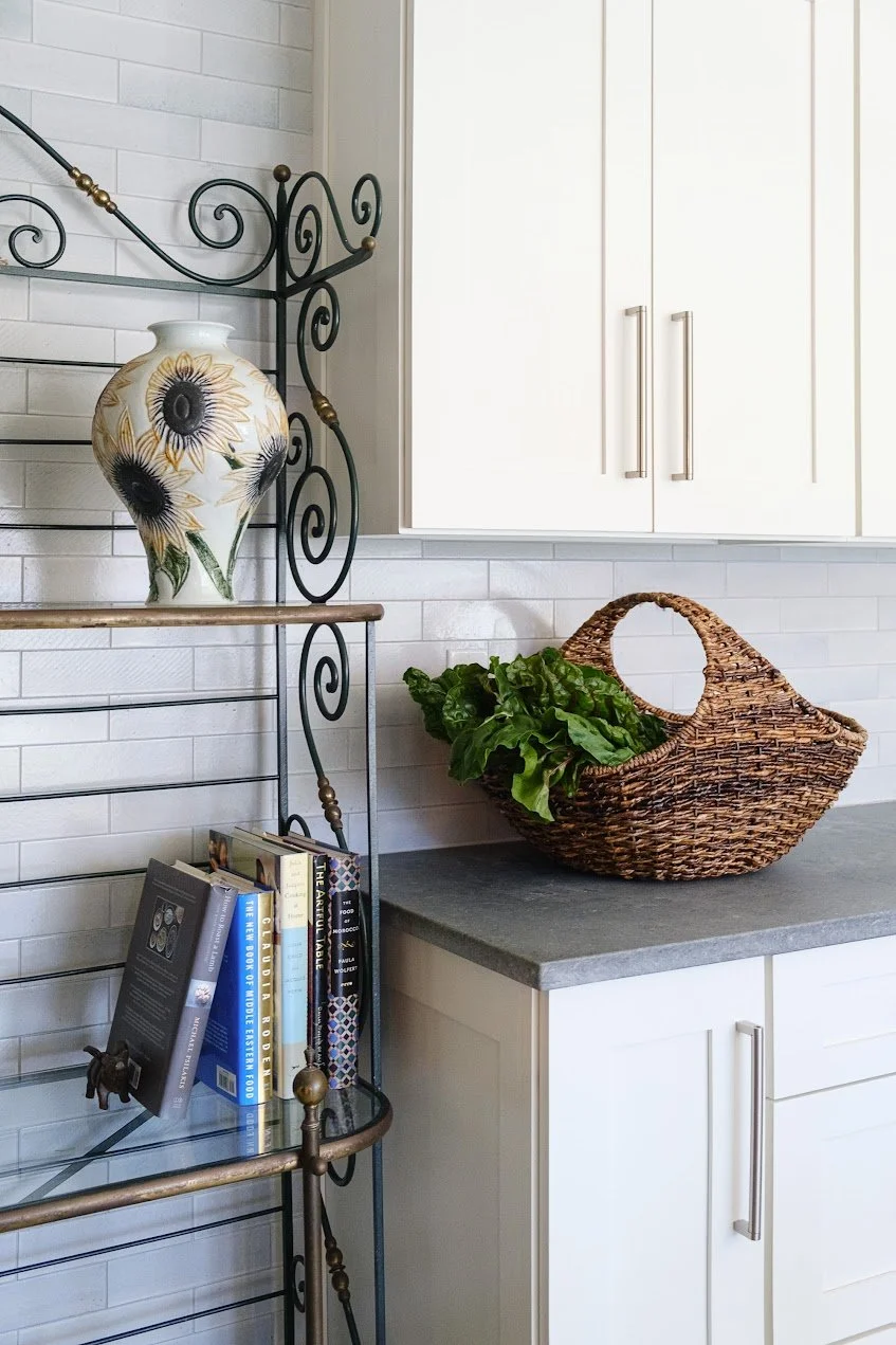 Custom baker's rack in a renovated Bronxville Tudor kitchen featuring integrated storage and display space.