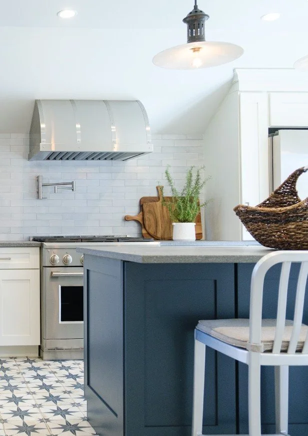 Custom range hood in a renovated Bronxville Tudor kitchen with tailored cabinetry and refined architectural details.