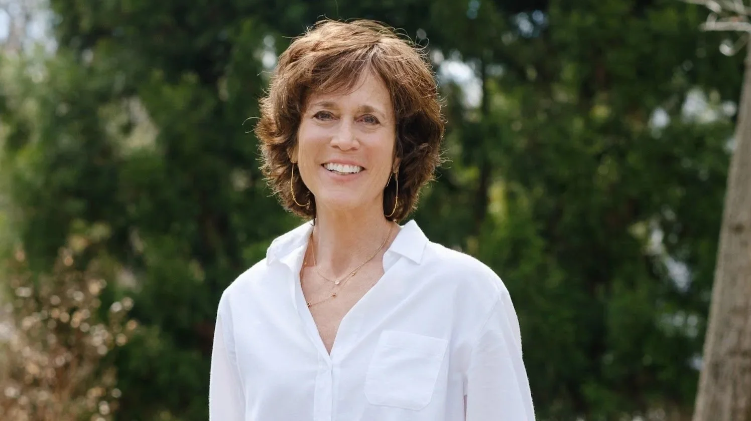 Karen Kline, founder and principal designer of Spice Hill Interiors, photographed outside a recently completed residential design project in Bronxville, New York