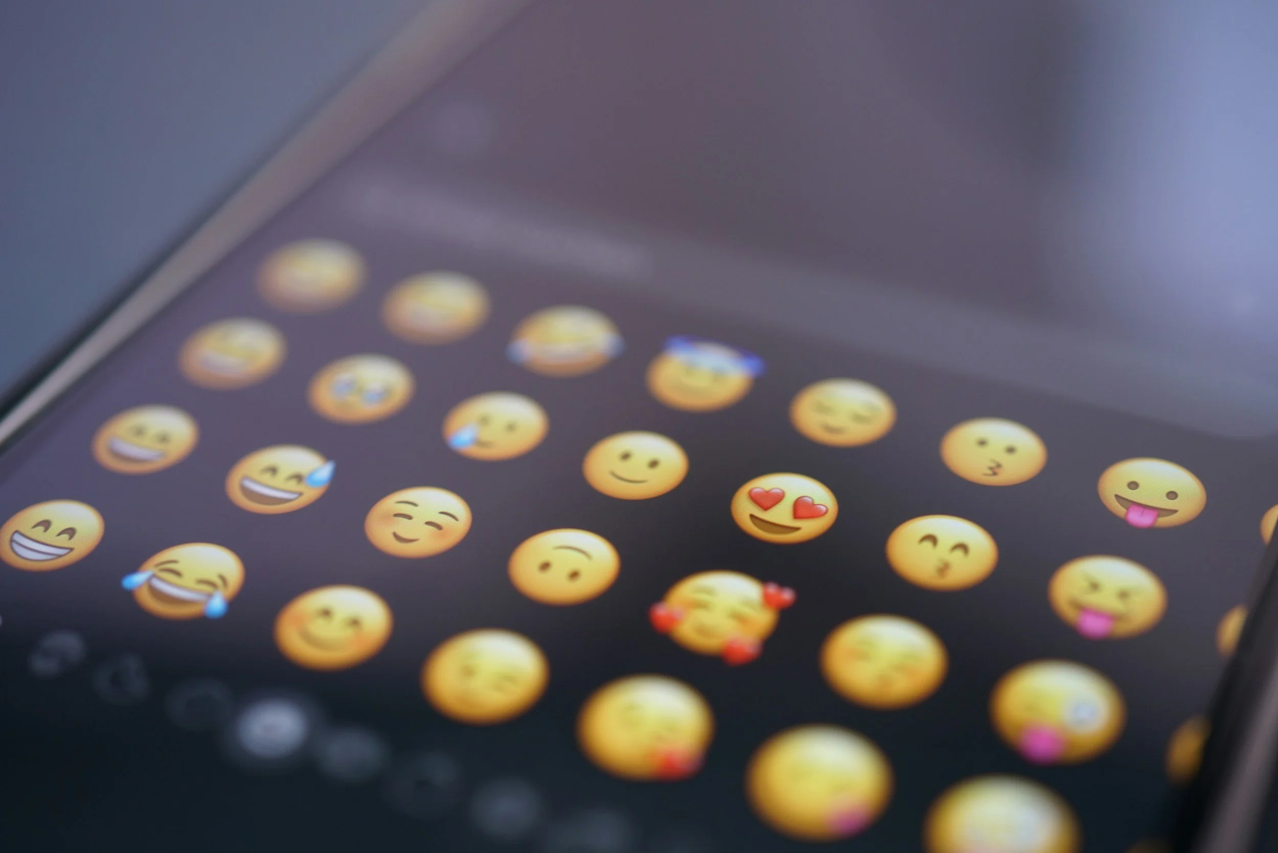 Who decides which emojis get made?
