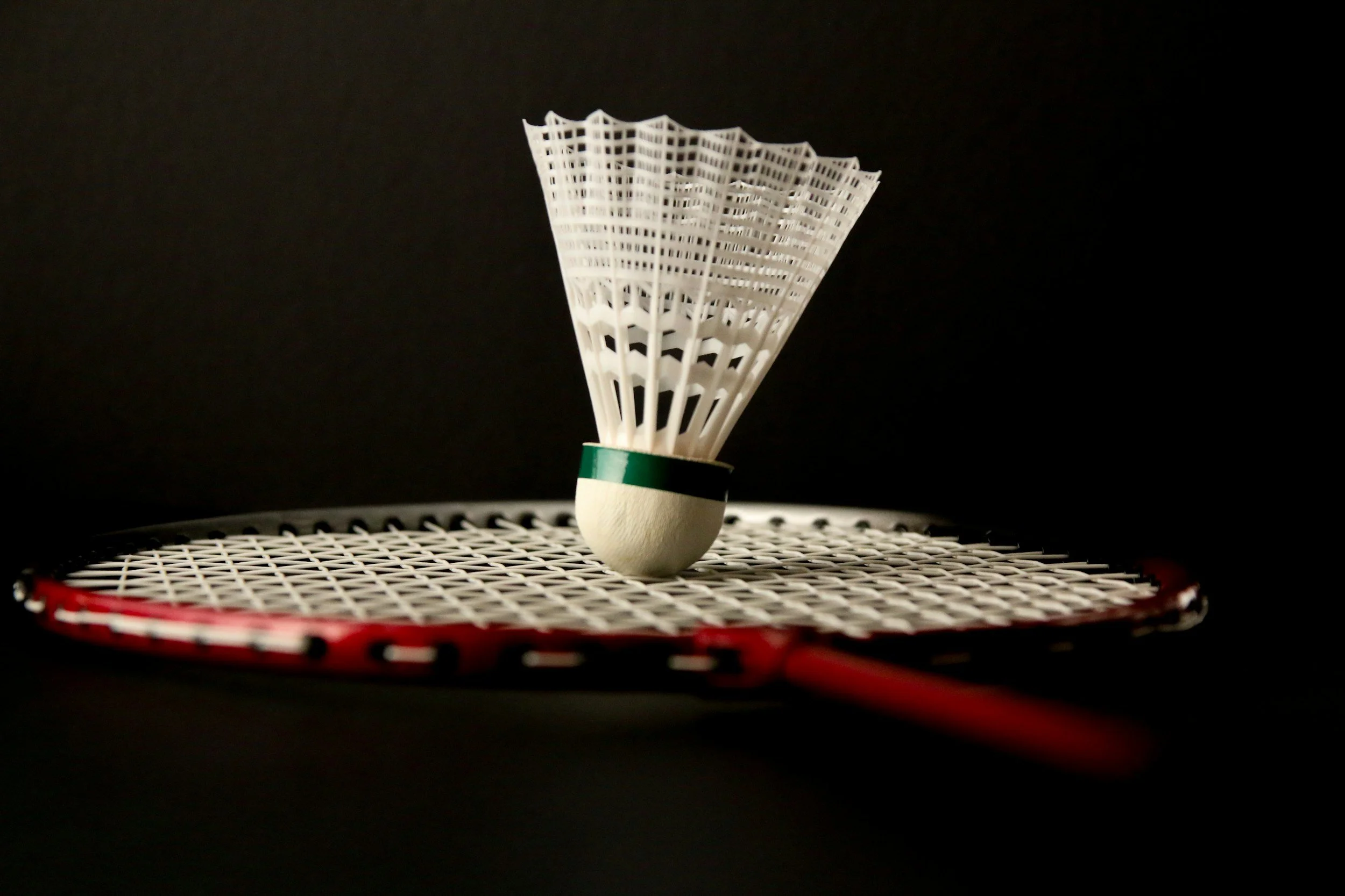 Why does a shuttlecock turn when you hit it?