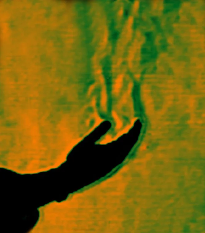 This image shows warm air rising from a human hand, with the green border highlighting the boundary layer.
