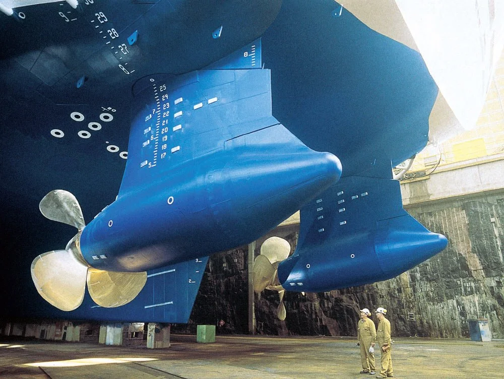 Azimuth thrusters or Azipods positioned "backwards" on a ship with people for reference.